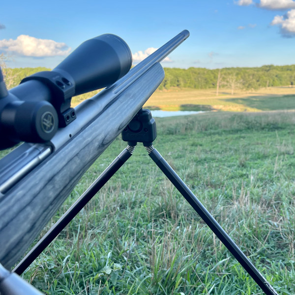 Rifle set up on a bipod in wait for a coyote